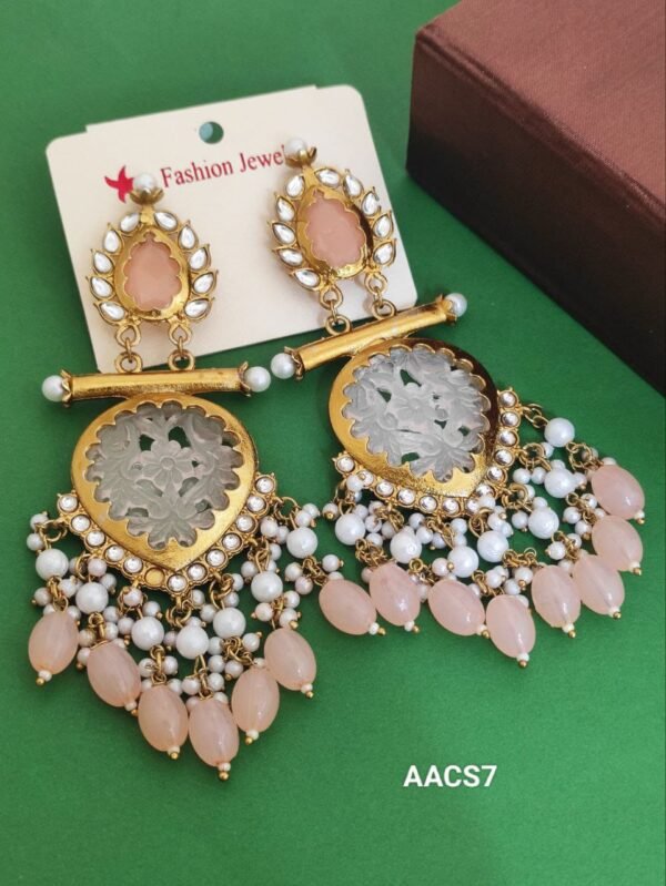 Heavy earring with long pearl detailing