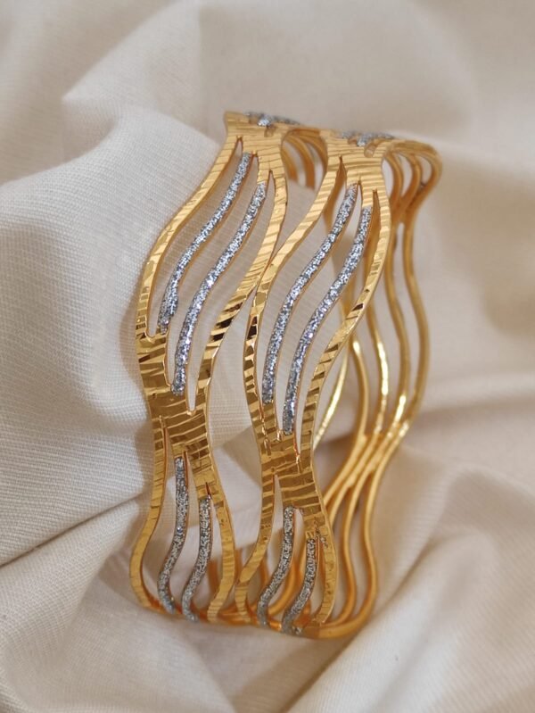 Gold bangles for women with intricate designs